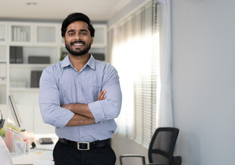 Confident professional standing in a well-lit office space - 3webindia.com