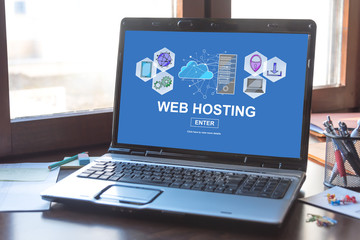 Laptop on desk showing web hosting graphics for 3webindia.com’s services.