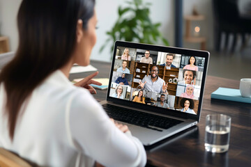 Remote workers participating in an online conference call via laptop
